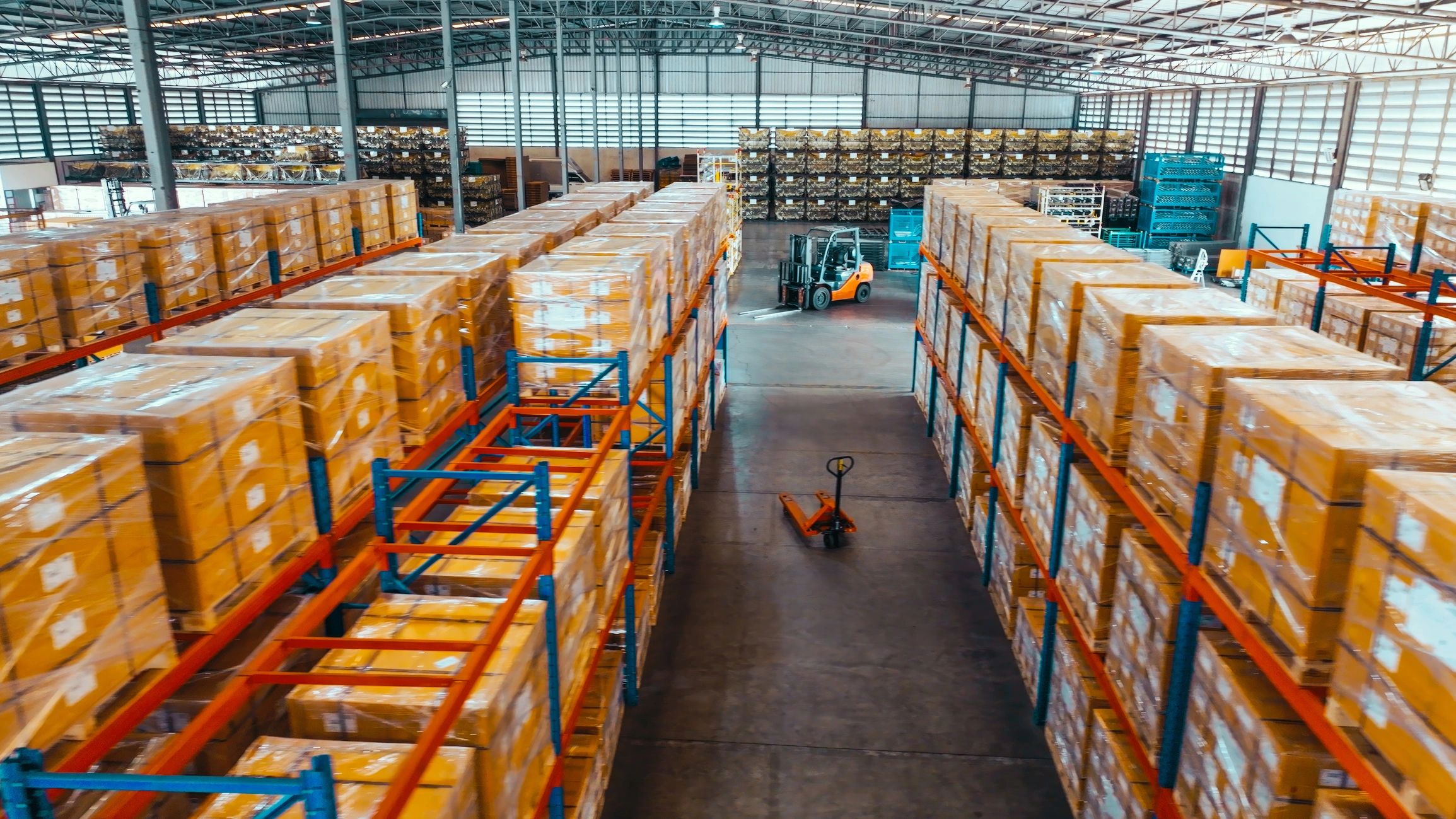 Warehouse shelves stocked with packaged goods in a modern logistics facility